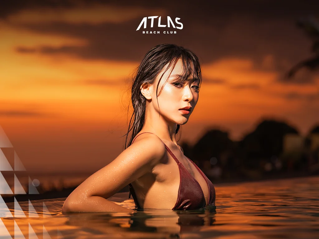 Oceanfront dining at Atlas Beach Club, Bali sunset dining, luxury beach club experience.