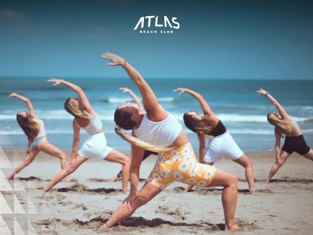 Explore Bali’s top beaches offering yoga classes designed for families, featuring stunning views and skilled instructors. Beachside yoga classes, yoga mats on sand, tropical setting for family wellness.