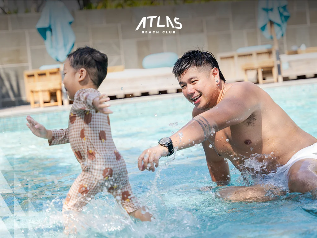 Family-friendly activities at Atlas Beach Club, kids' play areas at Atlas Beach Club, parents relaxing at Atlas Beach Club.
