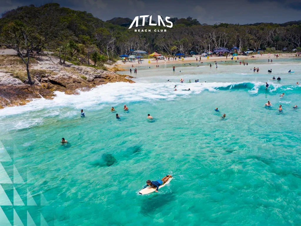 Family-friendly activities in Bali and Gold Coast include beach clubs, theme parks, and cultural experiences Family at Atlas Beach Club, Gold Coast theme park, kids enjoying coastal walks